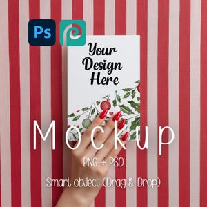 May include: A mockup design template with the text "Your Design Here" and a festive holly and berry design. The image includes the text "Mockup", "PNG + PSD", and "Smart object (Drag & Drop)". The background is red and white striped.