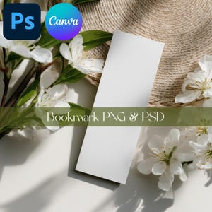 May include: A plain white bookmark with the text "Bookmark PNG & PSD" is shown diagonally. White flowers and green leaves surround the bookmark, with the Adobe Photoshop and Canva logos in the upper left corner.