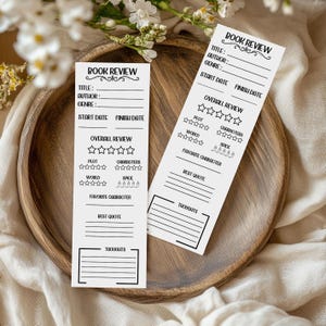 May include: Two printable book review bookmark templates with a black and white design. Each template includes sections for title, author, genre, start date, finish date, overall review, plot, characters, world, spice, favorite character, best quote, and thoughts.