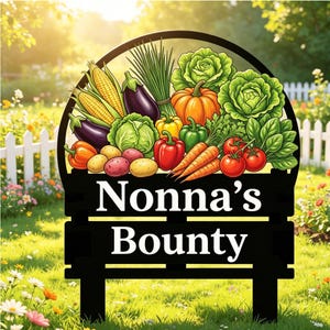 May include: Black metal garden sign with the words "Nonna's Bounty" and a colorful illustration of fresh vegetables. The illustration includes corn, eggplant, cabbage, peppers, carrots, tomatoes, and potatoes. The sign is set in a garden with a white picket fence.