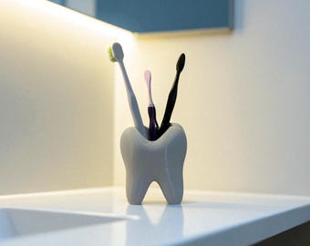 Porte-brosse à dents en forme de dent : décoration amusante pour cabinet dentaire