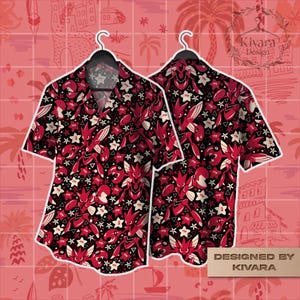 May include: Two short-sleeved button-down shirts with a black background and a repeating pattern of red and white stylized figures and stars. The shirts are hanging on black hangers against a pink background with a grid pattern.