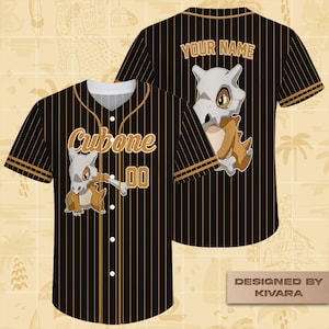 May include: Black baseball jersey with gold pinstripes, featuring a Cubone graphic and the text "Cubone 00". The back of the jersey has a Cubone graphic and the text "YOUR NAME". The jersey is designed by Kivara.