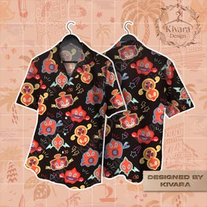 May include: A black short-sleeved button-down shirt featuring an all-over print of various red, orange, and blue cartoon characters resembling small robots or creatures, interspersed with small lightning bolt and star shapes throughout the fabric.