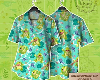 May include: A short-sleeved button-down shirt featuring a repeating pattern of green frog-like creatures, blue tadpoles, and red fish on a light blue water background with green lily pads. The shirt has a collar and a button-front closure.