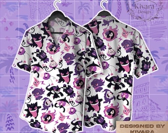 May include: A short-sleeve button-down shirt featuring an all-over print of purple and black ghost-like creatures on a white background. The design includes various stylized characters with expressive faces, tongues, and glowing elements throughout.