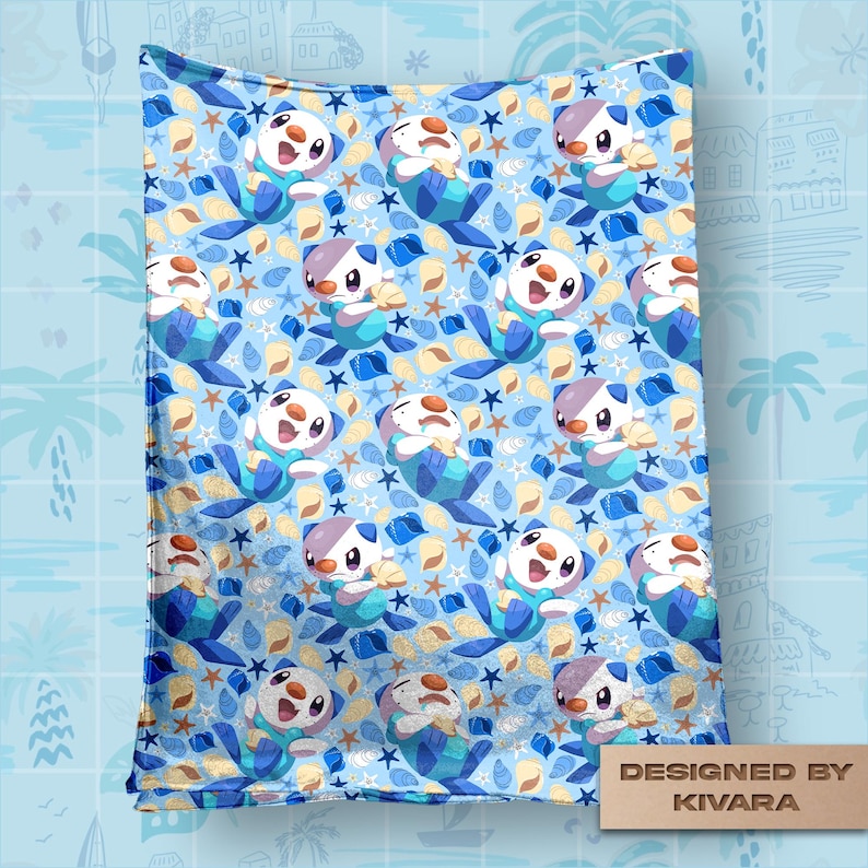 Op de afbeelding: Een lichtblauwe deken met een herhalend patroon van cartoon zeeotters, zeesterren en schelpen. De deken heeft een blauwe rand en de tekst "DESIGNED BY KIVARA" in de rechter benedenhoek.