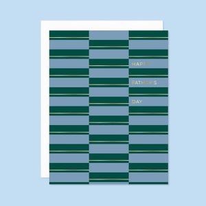 May include: A greeting card with a blue and green striped pattern. The text "Happy Father's Day" is written in gold lettering.