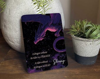 May include: A rectangular card with a purple and pink dragon illustration on a starry background. The card has the text: "A dragon without its rider is a TRAGEDY. A rider without its dragon is DEAD." The card is signed "Sherry".