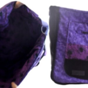 May include: Purple and black patchwork messenger bag with a zipper closure and a long adjustable strap. The bag has multiple pockets and a patterned lining.