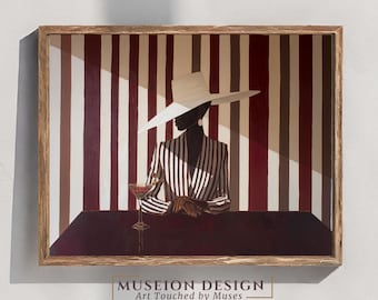 May include: A framed art print featuring a person in a striped suit and wide-brimmed hat, seated at a table with a cocktail. The background has vertical stripes in shades of red, white, and brown. The artwork is signed "MUSEION DESIGN Art Touched by Muses".