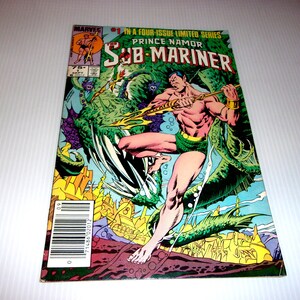 May include: A Marvel comic book titled The Sub-Mariner Prince Namor number 1 in a four-issue limited series. The cover features a muscular character with a trident fighting a large green sea creature above a yellow underwater city.