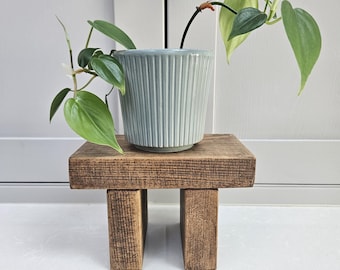 Handcrafted mini riser made from recycled wood.