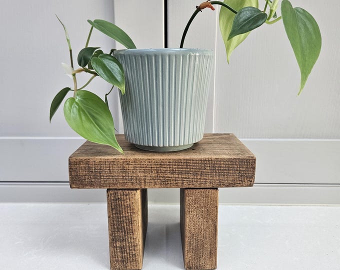 Handcrafted mini riser made from recycled wood.