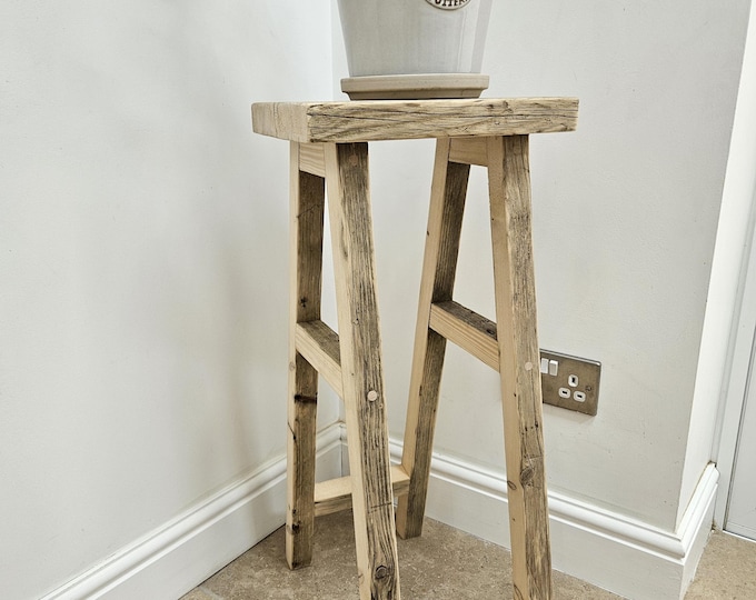A handmade rustic plant stand. sturdy and stylish