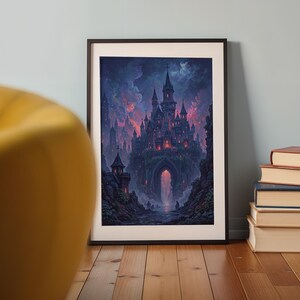 May include: Framed art print showing a gothic castle illustration. The artwork depicts a dark castle with spires and towers, set against a dramatic, colorful sky. The print is in a black frame and rests against a light blue wall. The print is displayed on a wooden floor.