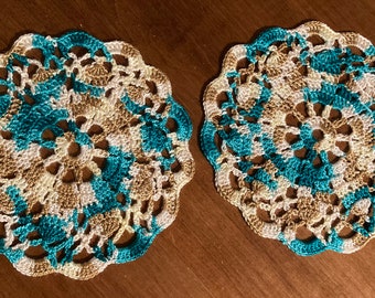 set of 2  Multi colored 6 inch doilies or coasters Handmade crocheted called Magnolias teal cream tan golden beach colors
