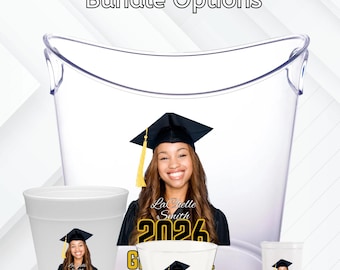 May include: Graduation party favor bundle options. The image shows a clear plastic tub and three different sized cups. Each cup features a photo of a smiling graduate wearing a cap and gown, with the text "2026 Graduate". The text "Graduation Party Favors" is at the top.