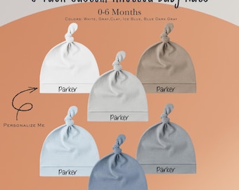 May include: A 6-pack of custom knotted baby hats in various colors, including white, gray, and blue. Each hat has a knotted top and a band with the name "Parker". The hats are designed for babies aged 0-6 months.