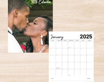 May include: A personalized 2025 wall calendar with a photo of a couple kissing. The calendar has a notes section and US holidays. The calendar is in a flip-style format.