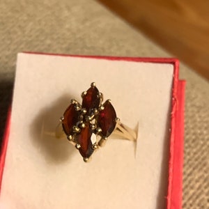 Mozambique genuine garnet ring, four faceted marquis stines, excellent condition , 14kt yellow gold, multiprong, TCJ hallmark, size 5 1/2.