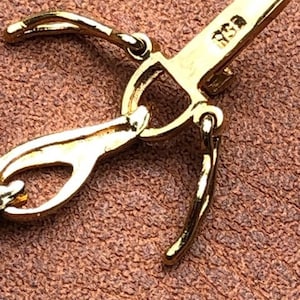 Gold vermeil bracelet, 925, sterling silver, 7 1/4” when on wrist, 5mm wide,, safety clasp, diamond