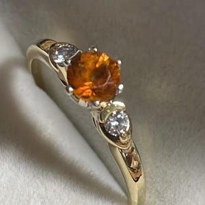 Genuine citrine ring, two side diamonds, prongs, bezels, 18kt gold, size 8.5, weighs 3 gms, nov birthstone
