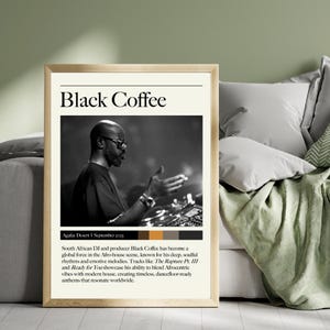 May include: Black and white photo of a DJ, Black Coffee, performing at a music festival in the Agafay Desert, Morocco. The text "Black Coffee" is in large, bold letters at the top of the poster. The text below the photo reads "South African DJ and producer Black Coffee has become a global force in the Afro-house scene, known for his deep, soulful rhythms and emotive melodies. Tracks like The Rapture Pt. III and Ready for You showcase his ability to blend Afrocentric vibes with modern house, creating timeless, dancefloor-ready anthems that resonate worldwide."