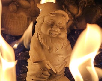 NAUGHTY Fire Pit Gnome hand poured using refractory cement. Great for outdoor gas or wood fire pit. Withstands temperature to 2300 degrees.