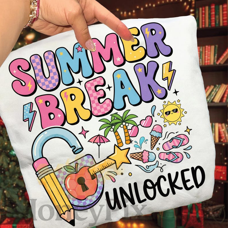 May include: White t-shirt featuring the words "SUMMER BREAK UNLOCKED" in a vibrant, playful font. The design incorporates summer icons like palm trees, ice cream, and a padlock with a pencil.