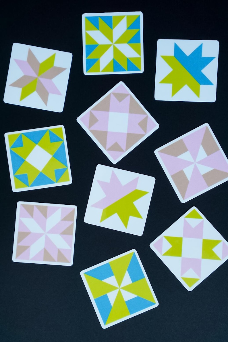 ini quilt block sticker set of 10 featuring bold geometric star and block designs in either bold and bright or soft and neon colorways. Each 1"x1" sticker is individually cut and packed. Waterproof vinyl, gloss laminated. Sticks to water bottles, laptops, planners, and sewing machines. The collector's set for the modern quilter — perfect for quilt retreat goodie bags and guild gifts.
