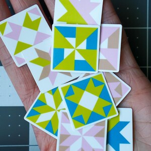 ini quilt block sticker set of 10 featuring bold geometric star and block designs in either bold and bright or soft and neon colorways. Each 1"x1" sticker is individually cut and packed. Waterproof vinyl, gloss laminated. Sticks to water bottles, laptops, planners, and sewing machines. The collector's set for the modern quilter — perfect for quilt retreat goodie bags and guild gifts.