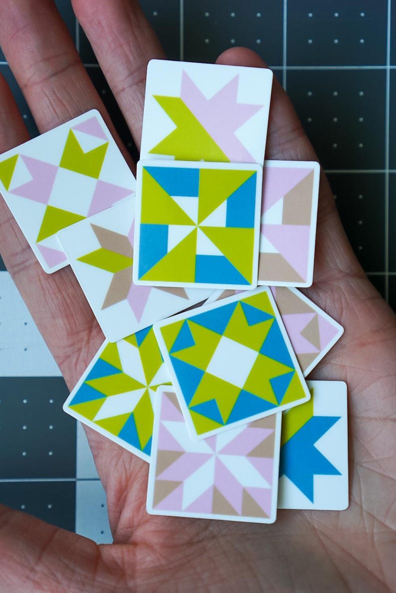 ini quilt block sticker set of 10 featuring bold geometric star and block designs in either bold and bright or soft and neon colorways. Each 1"x1" sticker is individually cut and packed. Waterproof vinyl, gloss laminated. Sticks to water bottles, laptops, planners, and sewing machines. The collector's set for the modern quilter — perfect for quilt retreat goodie bags and guild gifts.