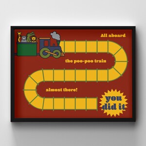 May include: A framed print featuring a whimsical train design. The train, with animal passengers, is on a yellow track labeled "the poo-poo train." Text includes "All aboard," "almost there!," and "you did it!" on a red background.