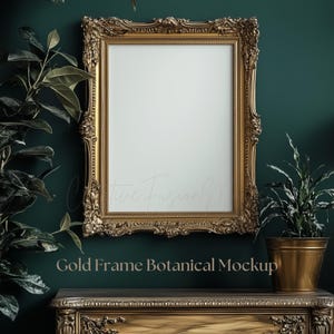 May include: A gold ornate frame with a white background, sitting on a wooden table with a gold finish. A green plant is in a gold pot to the right of the frame. The text "Gold Frame Botanical Mockup" is below the frame.
