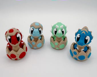 Juguete antiestrés con interruptor mecánico en forma de huevo de dinosaurio bebé impreso en 3D (Dinosaurio Kawaii)