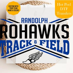 May include: White t-shirt with a graphic design for Randolph Rohawks Track & Field. The design includes the team name in blue and black, a winged shoe, and text that says "Custom with your team name & colors".