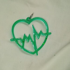 Heartbeat earrings and keychains