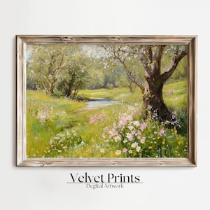 Pode incluir: Uma pintura de paisagem emoldurada retrata uma serena cena de prado. Grama verde exuberante e flores silvestres cercam um pequeno riacho. As árvores com folhagem verde clara emolduram a cena. O texto "Velvet Prints" e "Digital Artwork" está na parte inferior.