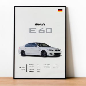 May include: White BMW E60 car poster with black wheels. The poster includes the text "BMW E60" and specifications: 5.0L engine, 507 PS power, 520 NM torque, 4000 lb weight, 0-60 MPH in 4.1 seconds, and a top speed of 200 MPH. The year is 2010.