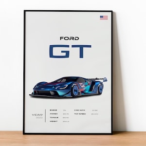 Op de afbeelding: Een ingelijste poster met een blauwe Ford GT raceauto. De poster bevat de tekst "FORD GT" in blauw, de Amerikaanse vlag en autospecificaties. Het jaar 2023 wordt ook weergegeven.