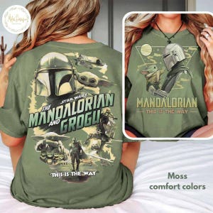 Peut inclure: T-shirt vert mousse avec des graphismes de la s&eacute;rie The Mandalorian. Le design comprend des images du Mandalorien, de Grogu et le texte "The Mandalorian and Grogu" et "This is the Way".