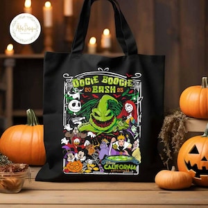 May include: Black tote bag featuring a colorful graphic for the Oogie Boogie Bash 2025 event at Disney California Adventure. The design includes characters like Jack Skellington, Sally, and Oogie Boogie. Pumpkins are in the background.