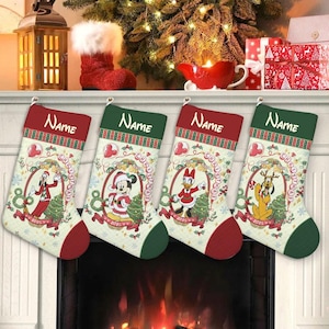 May include: Four Christmas stockings with Disney characters, including Goofy, Mickey Mouse, Donald Duck, and Pluto. Each stocking has a red or green cuff and heel, with a cream-colored body featuring a Christmas design and the year 2025.