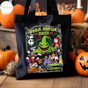 May include: Black tote bag featuring a colorful graphic with the text "Oogie Boogie Bash 20 Bash 25" and various Disney characters. The design includes Jack Skellington, Sally, and other Halloween-themed characters. Pumpkins are in the background.