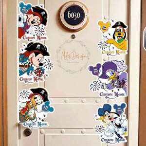 May include: Five colorful Disney character door hangers with a pirate theme. Each hanger features a different character, including Mickey Mouse, Minnie Mouse, Donald Duck, Goofy, and Daisy Duck. The hangers are decorated with fireworks and the text "Custom Name".