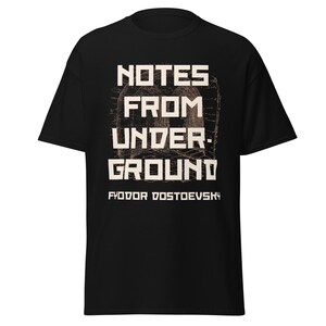 May include: Black t-shirt with white text that reads "NOTES FROM UNDERGROUND" and "FYODOR DOSTOYEVSKY".