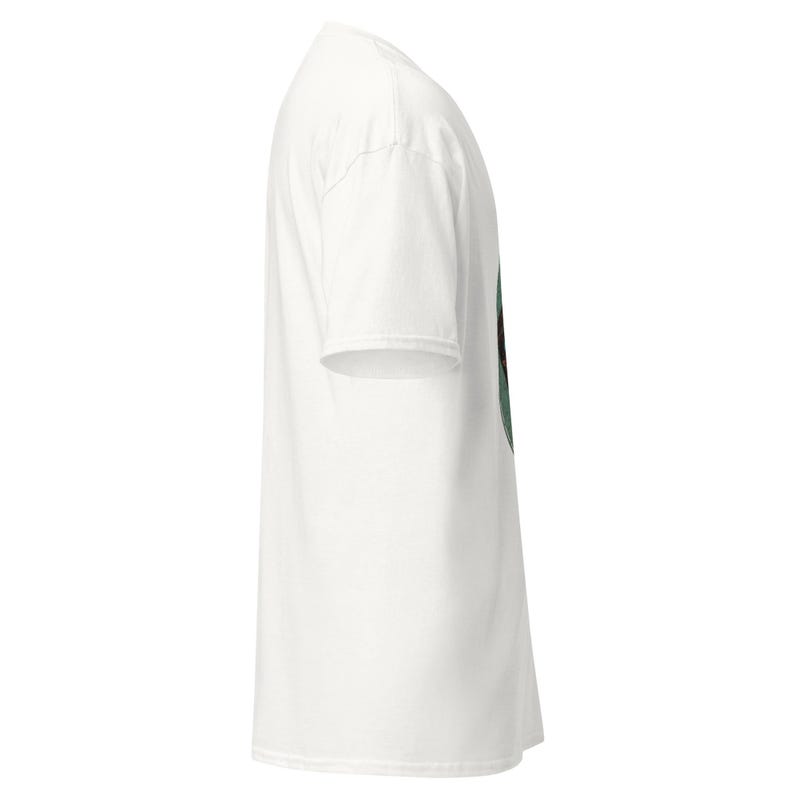 May include: A white t-shirt with a crew neck and short sleeves. The shirt is made of a soft material and has a slightly textured appearance. The side view shows the shirt's shape and design.