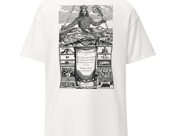May include: White t-shirt featuring a black and white graphic print. The graphic depicts a crowned figure holding a sword and scepter, with text that reads "Leviathan". The design includes various illustrations and text.