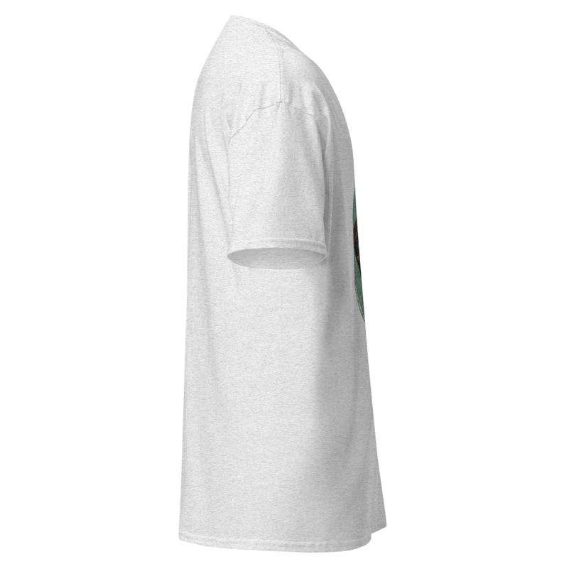 May include: A light gray t-shirt with a short sleeve design. The shirt has a crew neck and a side view. The fabric appears to be a soft, heathered material.